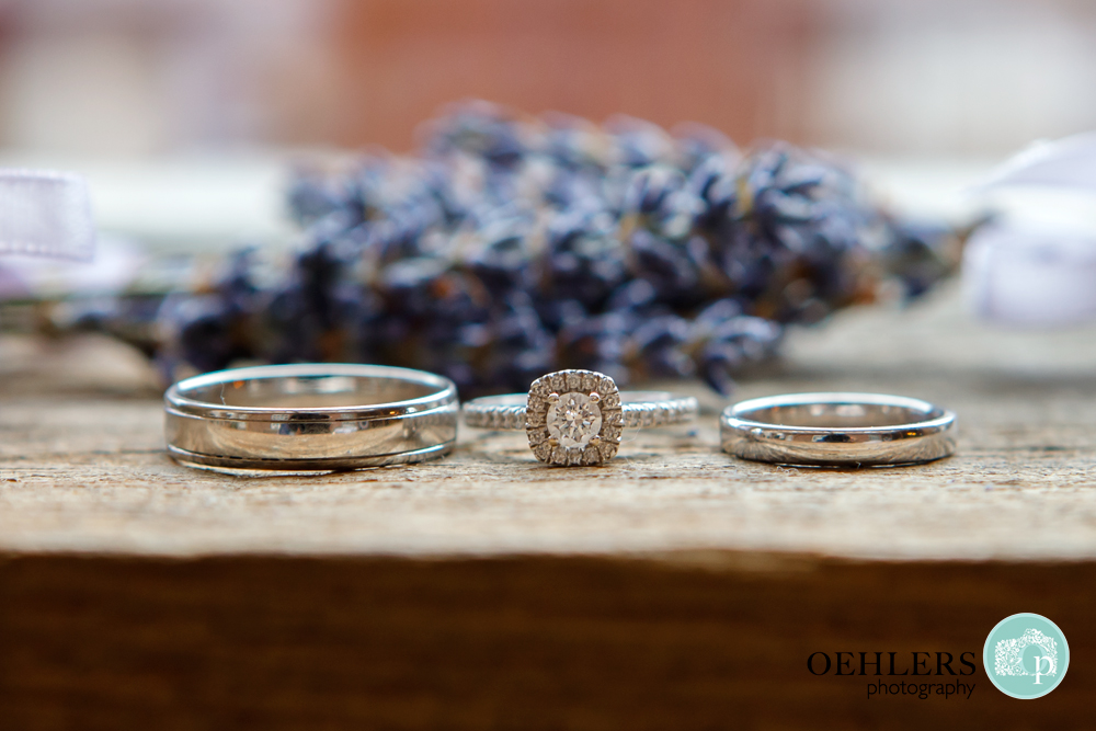 wedding rings and engagment rings lying flat
