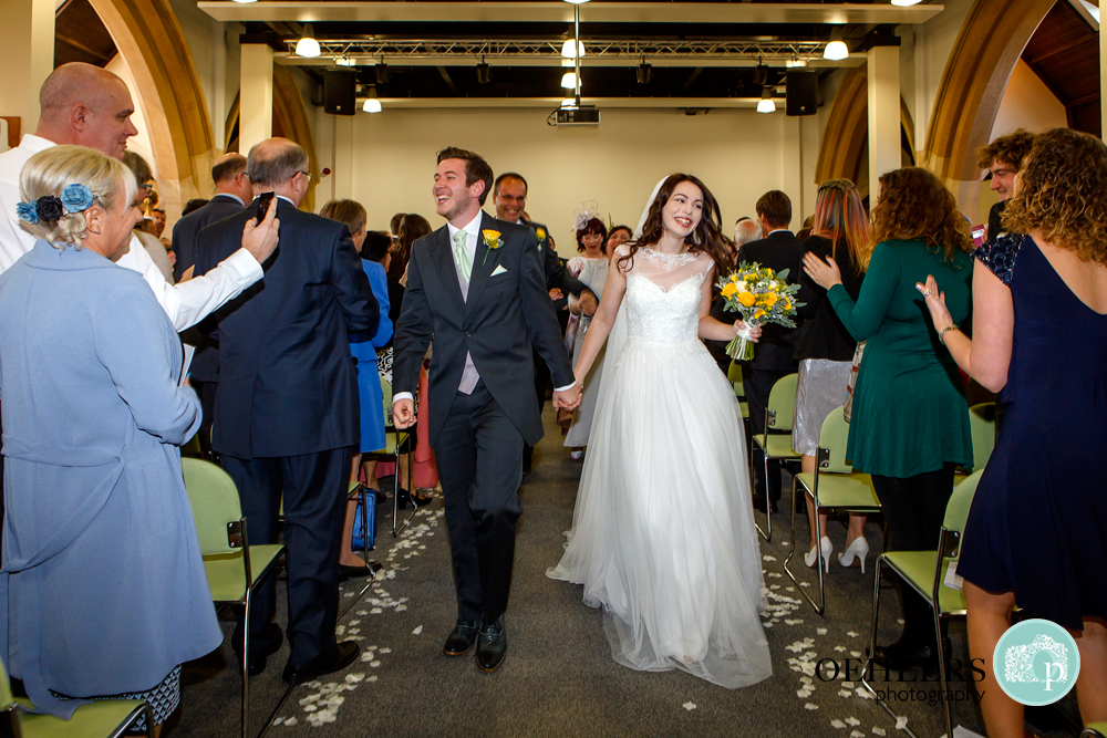 walking back up the aisle hand in hand