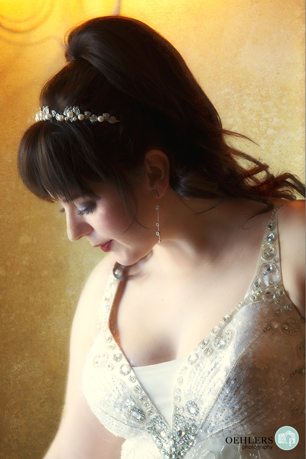 Beautiful, romantic portrait of a bride looking down.