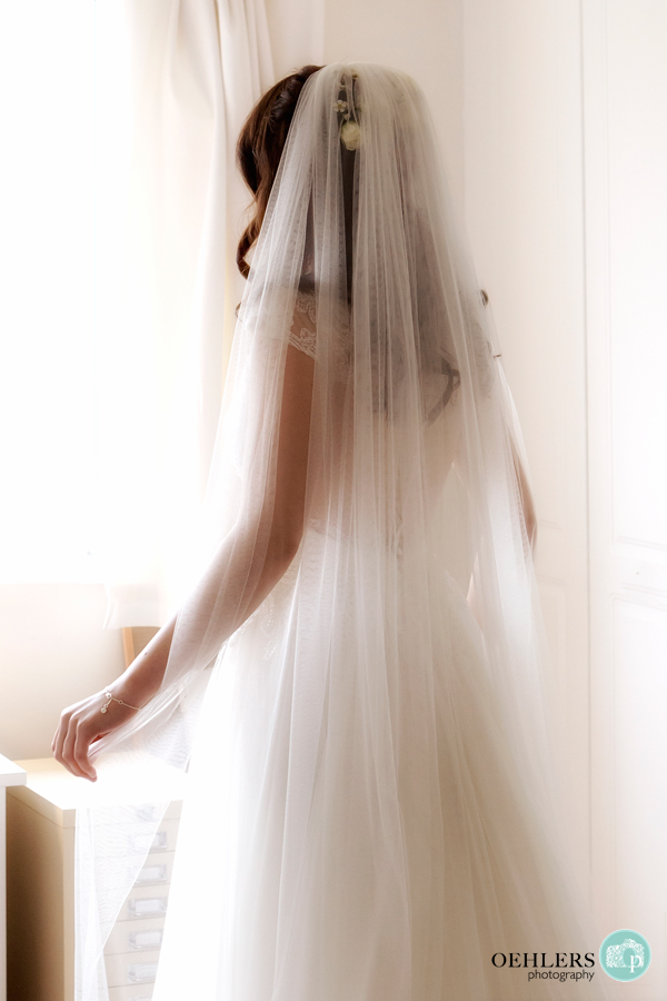 Lovely, soft photograph of the bride in her wedding dress.