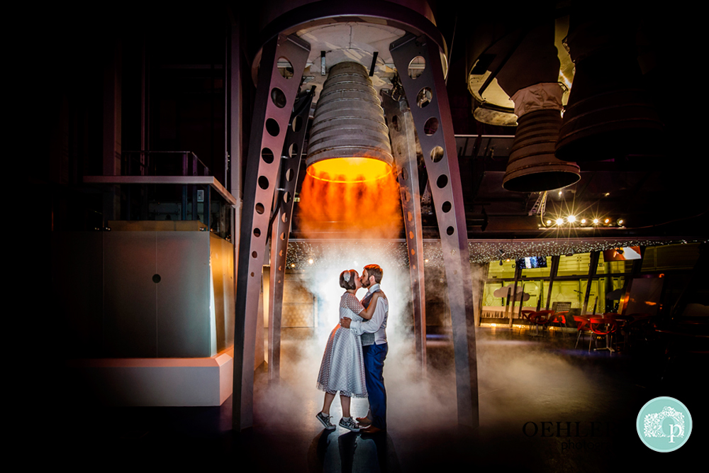 Bride and Groom under a rocket in the Space Centre