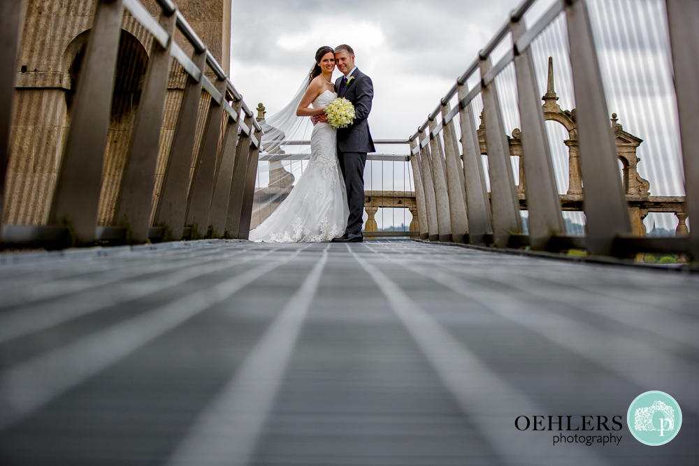 Low perspective of Bride and Groom at the end of leading lines