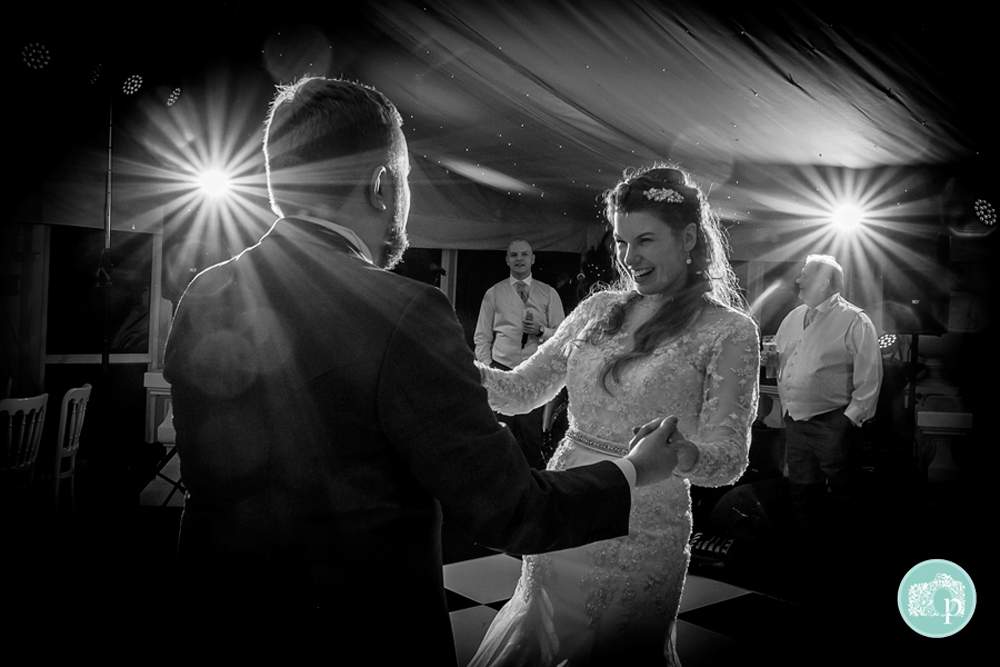 Black and White shot of Bride and Groom enjoying their dance