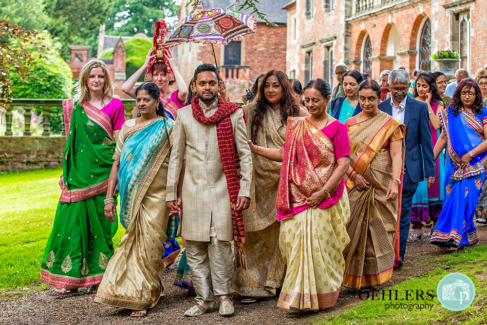 Indian Groom being led to the ceremony by guests