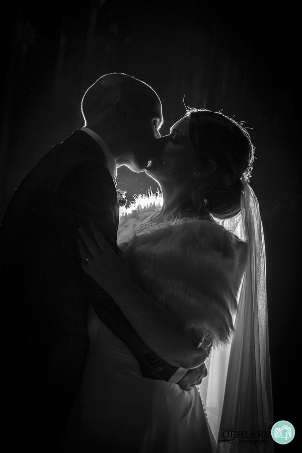 Backlit shot of Bride and Groom in the evening