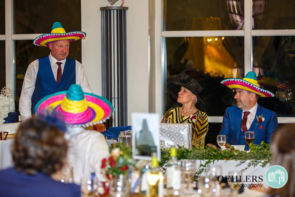 Best man wearing a sombrero whilst delivering a speech