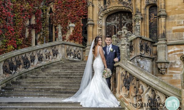 Bride and groom on magnificent staircase at Carlton Towers