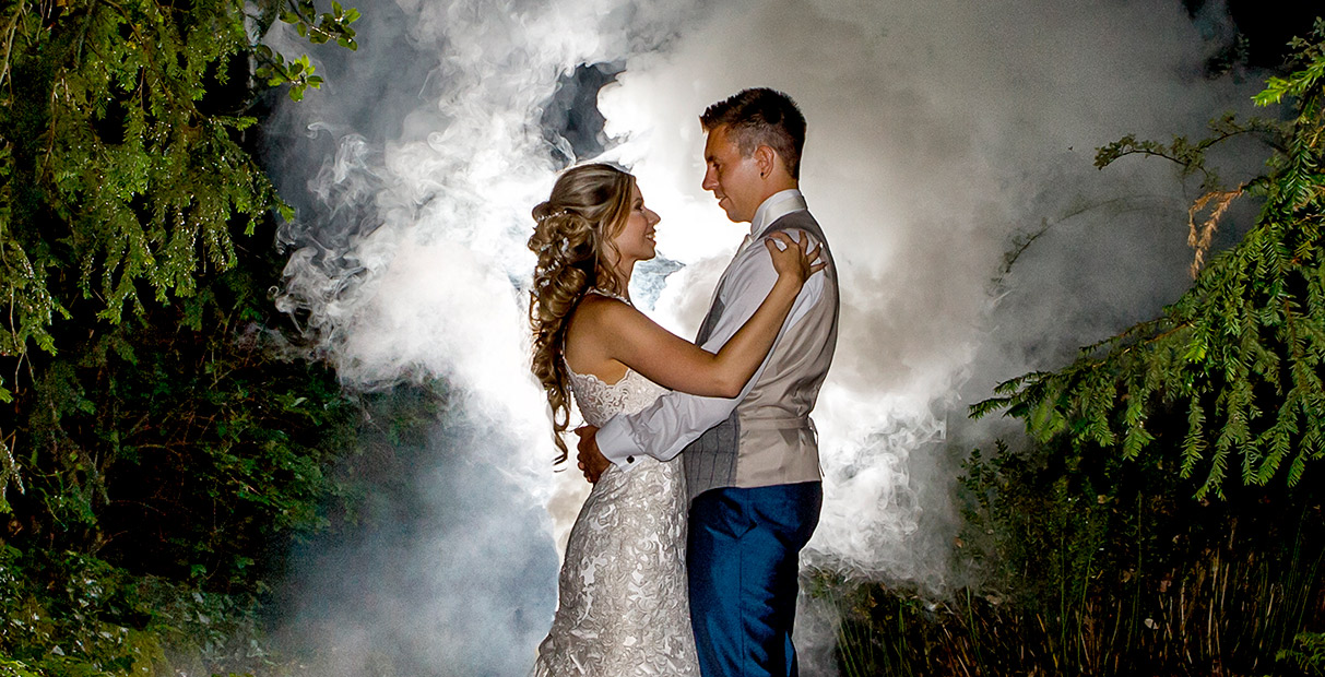 Nottingham Wedding Photographers-Bride and Groom in front of smoke bomb background