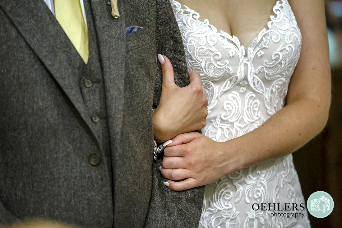 Bride holding the from tightly