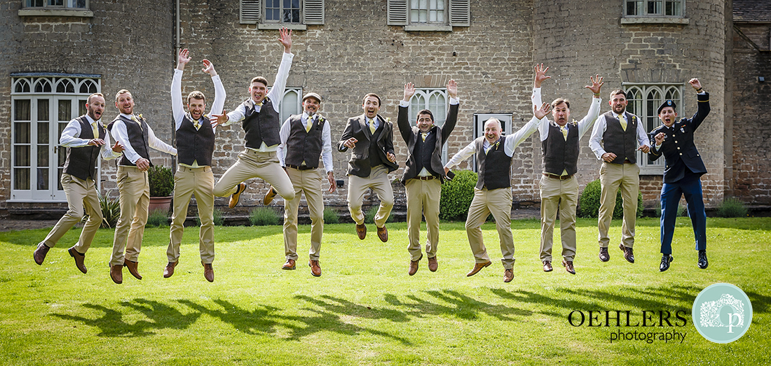 Groomsmen jumping up in the air