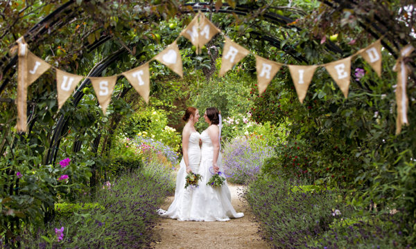 Couple in front of Just Married bunting