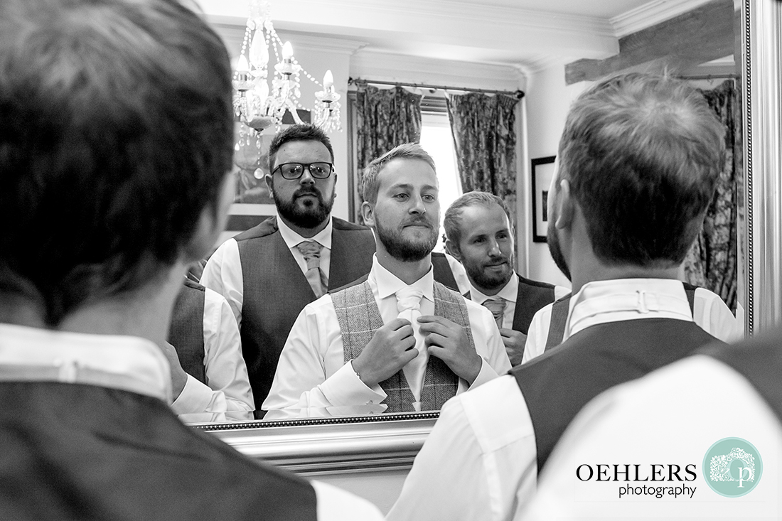 Swancar Farm Wedding Photography-Groomsmen looking in the mirror