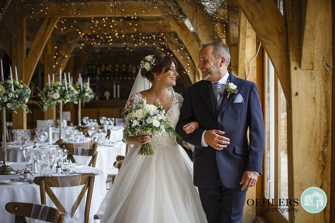 Swancar Farm Wedding Photography-Dad looking at bride as he walks bride towards ceremony room