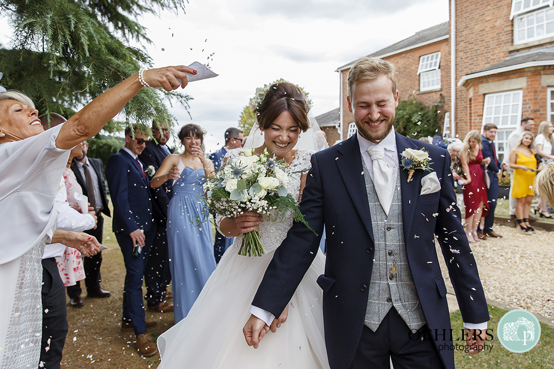 Swancar Farm Wedding Photography-Confetti thrown at the bride and groom