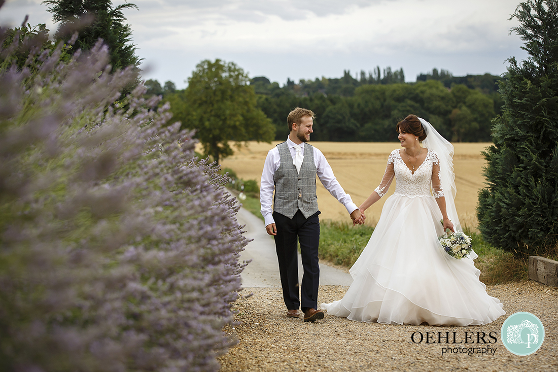 Swancar Farm Wedding Photography-Bride and Groom walking up the drive towards the venue