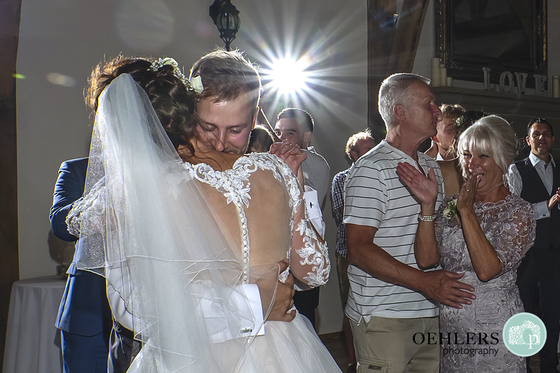 Swancar Farm Wedding Photography-Bride and Groom having a cuddle at end of first dance