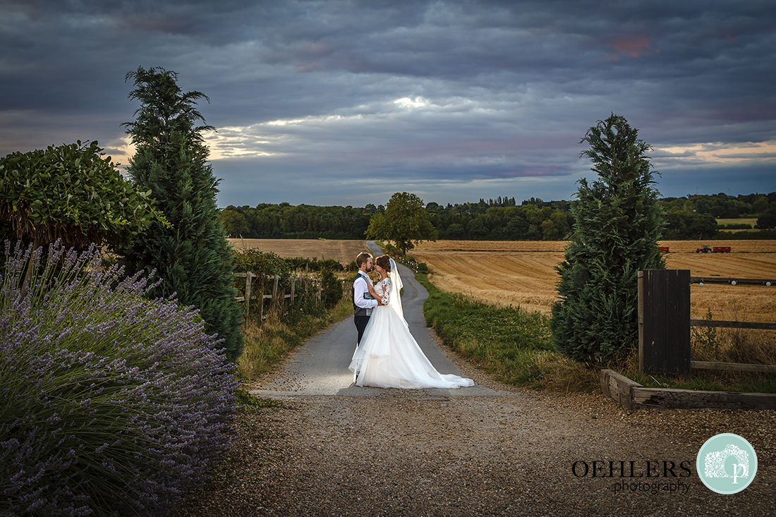 Bride and Groom with fields of countryside behind them