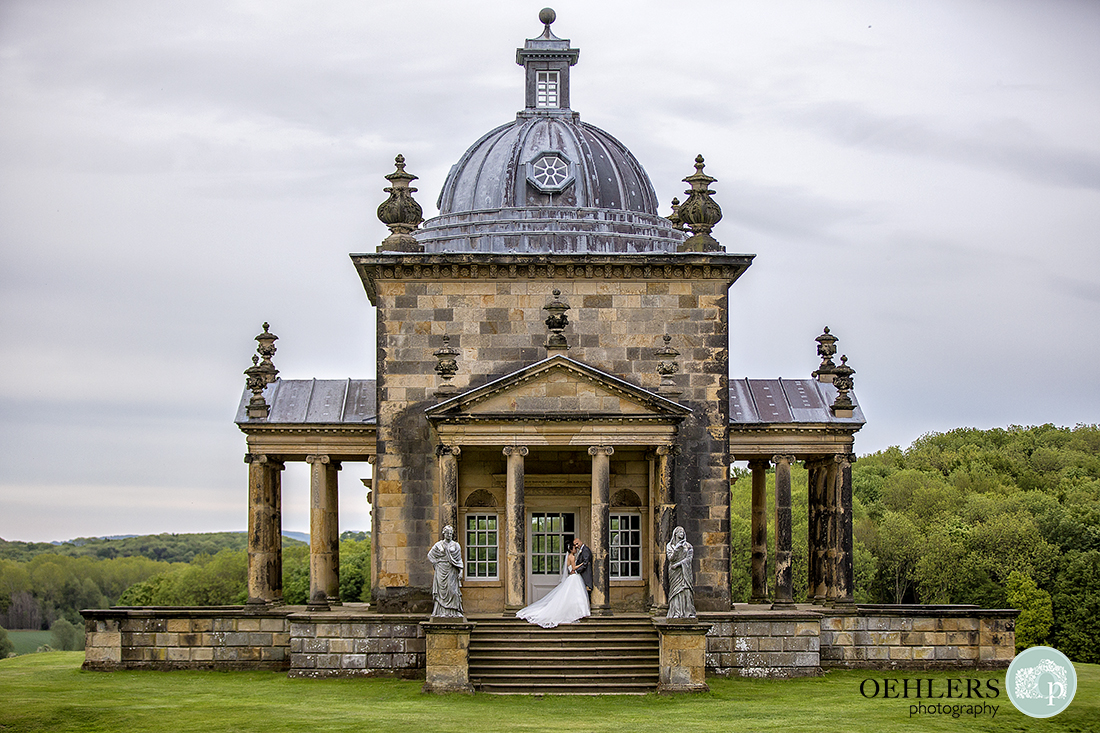 Bride and Groom at The Temple of the Four Winds at Castle Howard, Yorkshire.