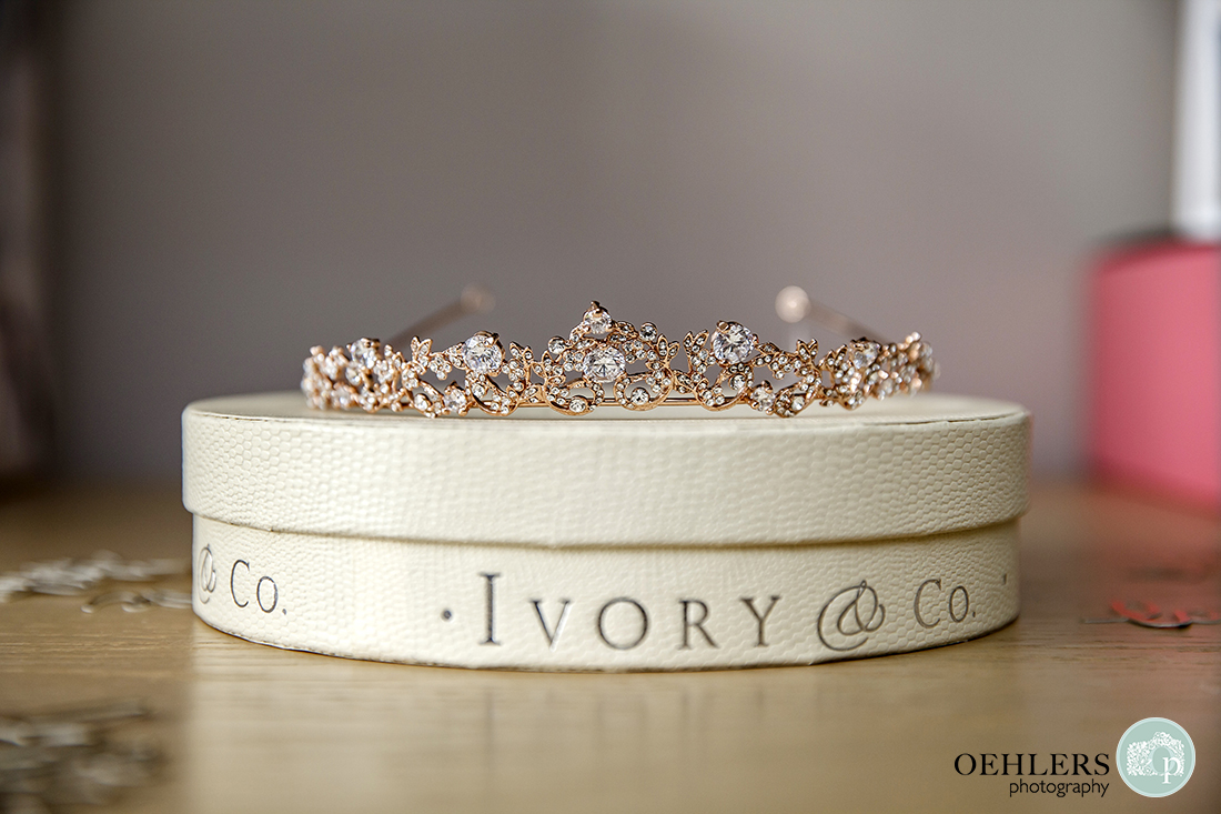 Rose-gold wedding tiara from Ivory & Co on top of their branded box.