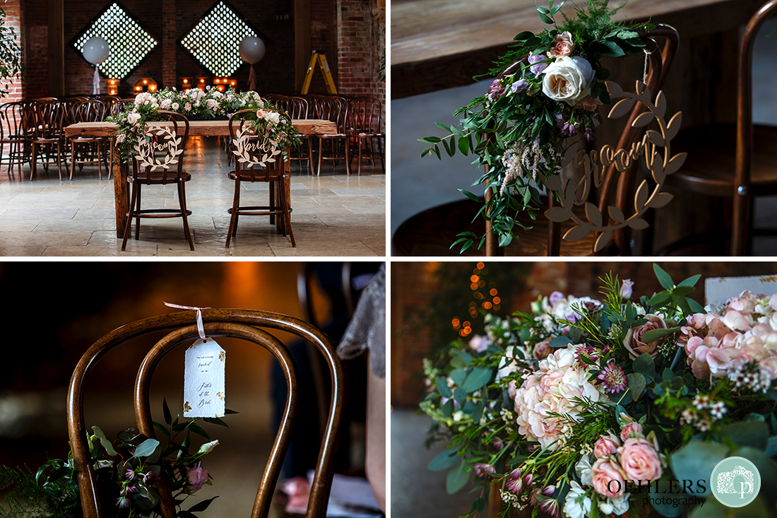 Shustoke Barn Wedding Photographer-Bride and groom's wedding ceremony table and chairs bedecked with gorgeous flowers.