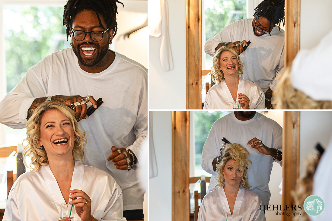 reflection in the mirror of bride and hairdresser having a giggle as she has her hair done.