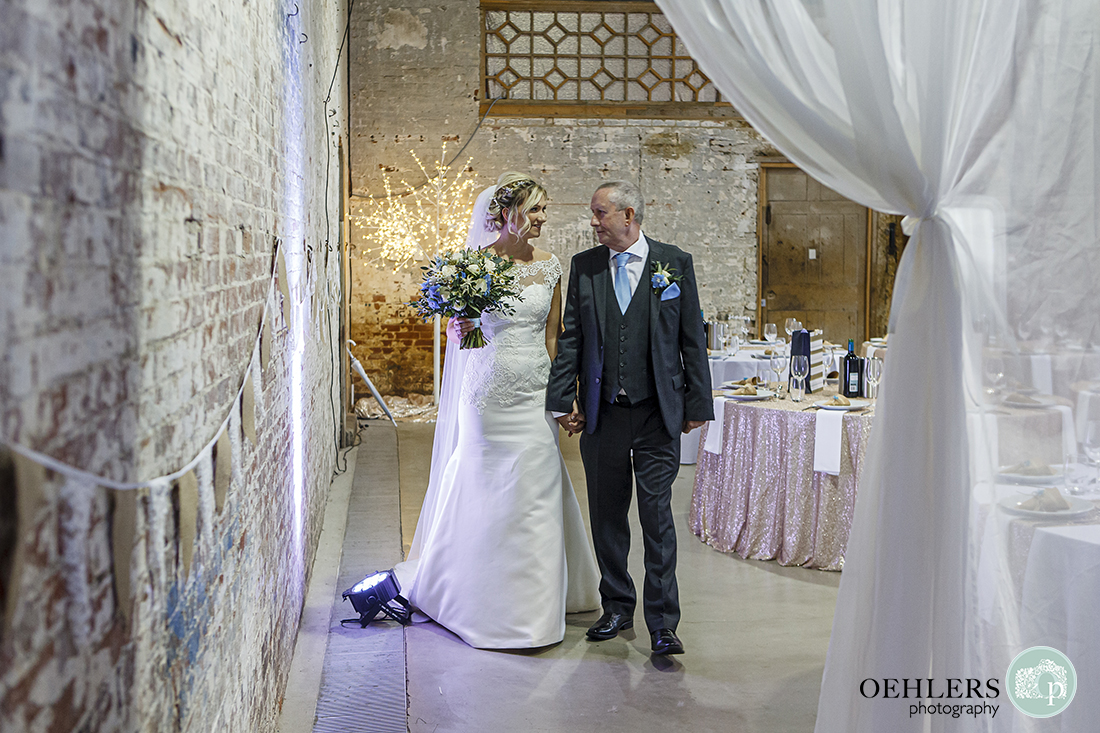 bride looking at her dad before going down the aisle