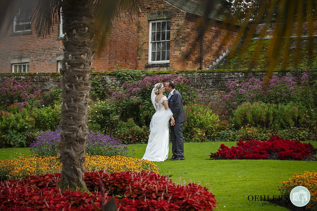 couple kissing in the gardens at Calke Abbey