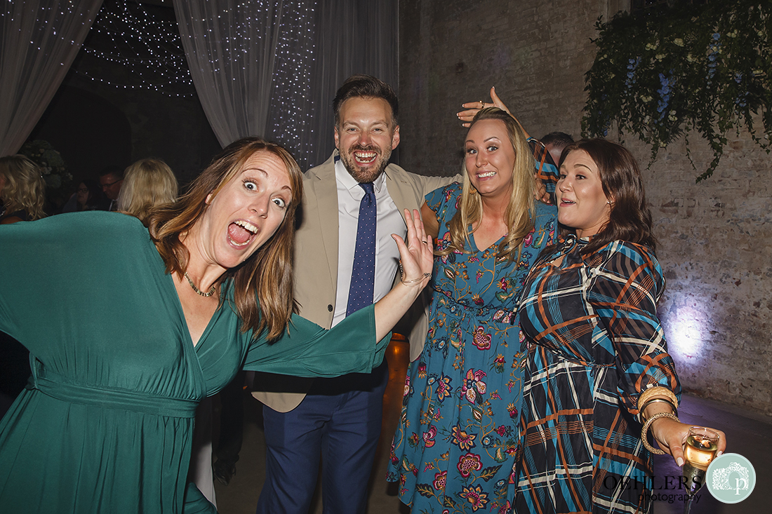 wedding guests posing casually for a photograph