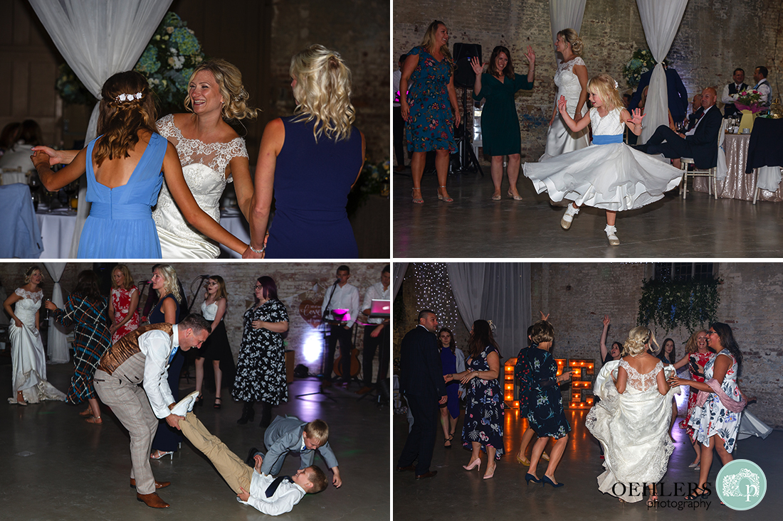 guests and bride on the dance floor showing off their moves