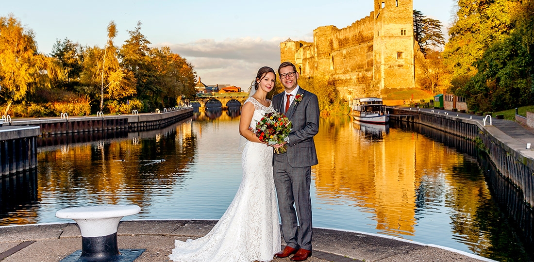 couple posing in front of Newark Castle