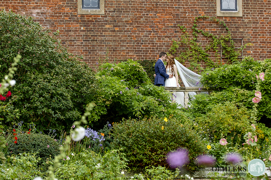 Romantic photo of the Bride and Groom in the garden of Thrumpton Hall.