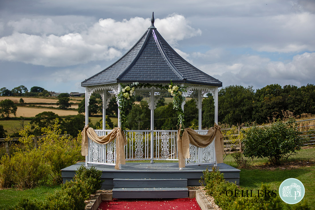 Shottle Hall's gazebo decked with hessian and flowers.
