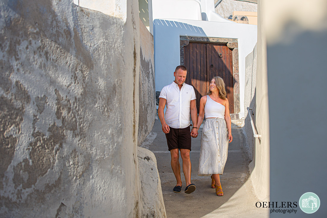 Megalochori village - couple walking down the narrow streets of Megalochori.