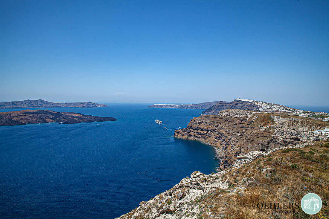 The spectacular view over Santorini's caldera to the blue Aegean Sea.