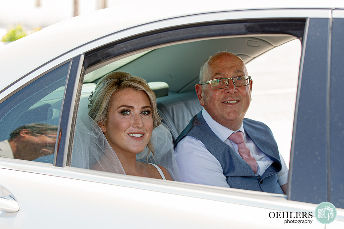 Santos Winery Weddings - bride with her dad in the car arriving.