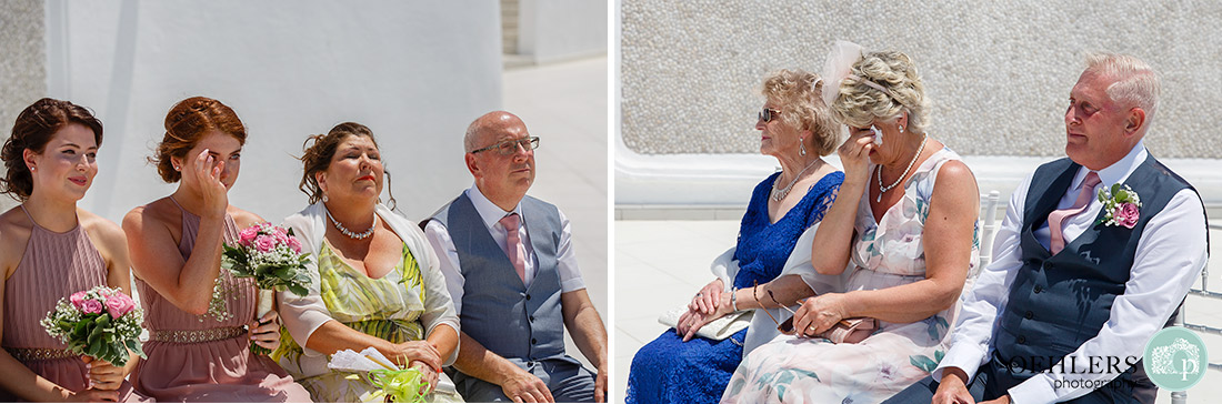 Santorini Destination Wedding Photographers - emotional tears amongst the guests.