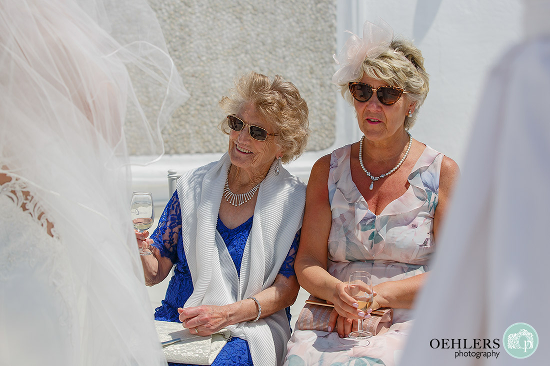 Two happy guests in dark glasses.