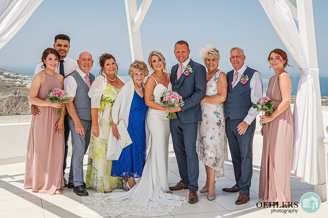 Group shot of the bride and grrom with their guests.