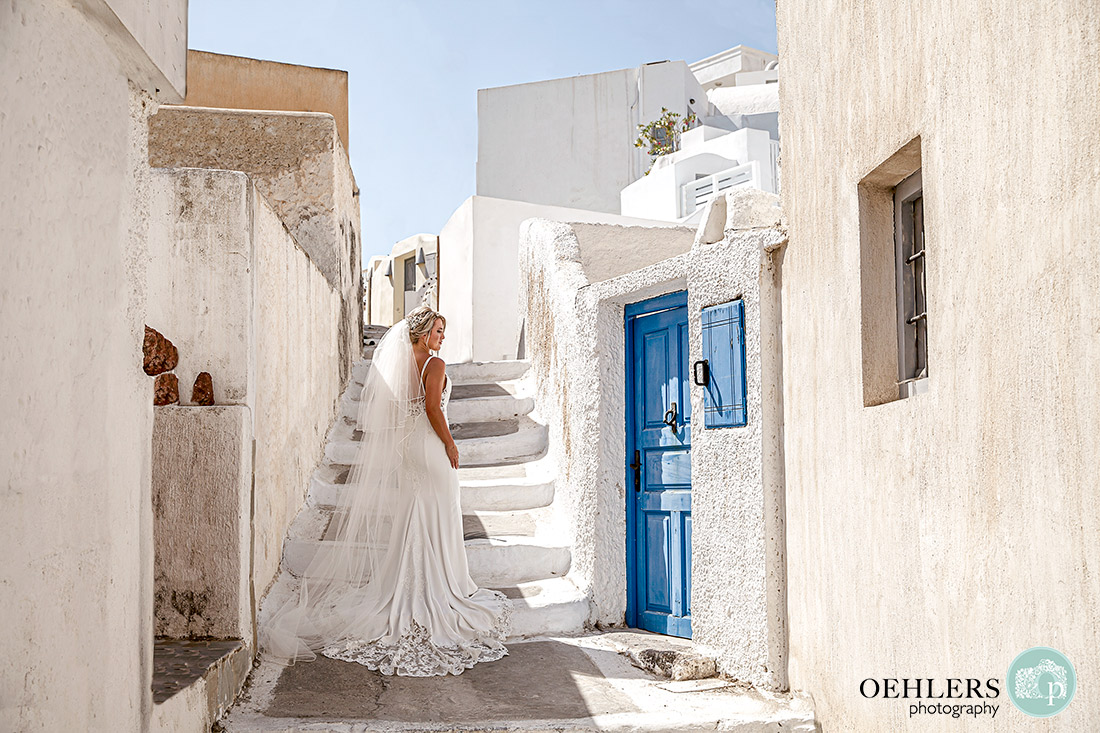 Beautiful photograph of the bride posing on a pathway in Megalochori.