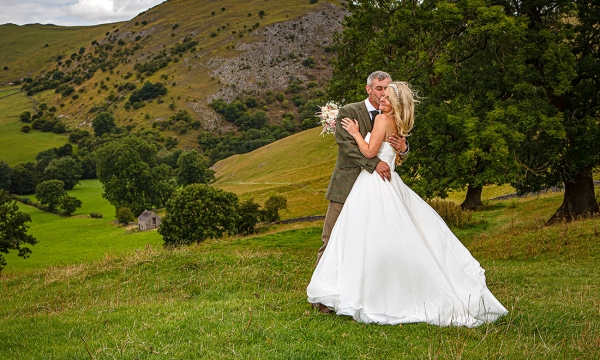 bride and group on top of a hill