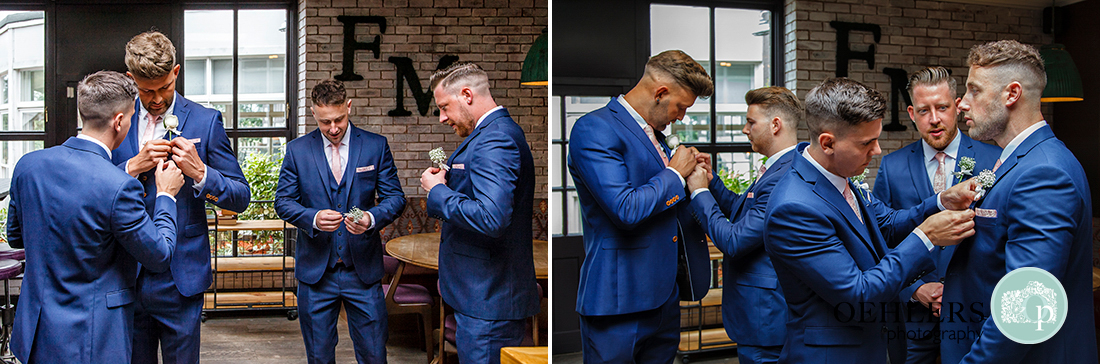 Osmaston Park wedding photography - Groomsmen putting on their button holes.