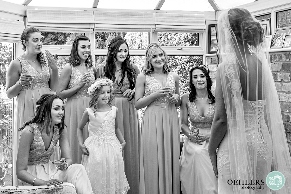 Osmaston Park wedding photography - Bridesmaids seeing their bride in her dress.