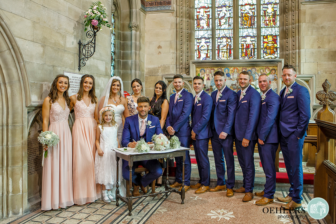 Osmaston Park wedding photography - bridal party lined up behing the registration table