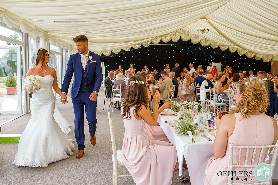 Osmaston Park wedding photography - bride and groom entering the wedding breakfast room